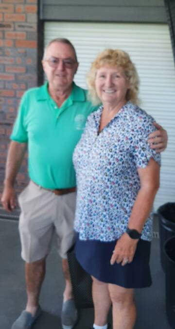 Sponsor Steve Kriss congratulates veterans golf winner Anne Wand.