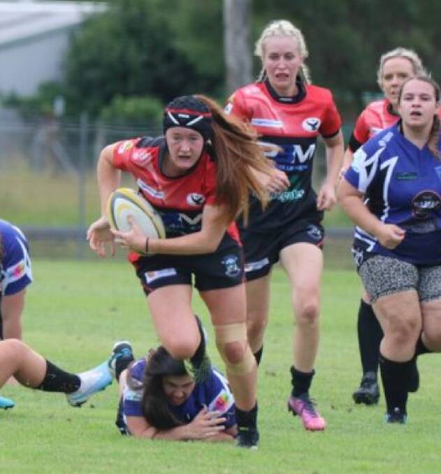 Olivia Marsh makes ground for the unbeaten Gloucester Cockies.
