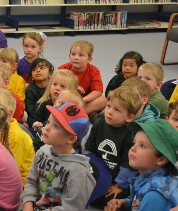 Gloucester preschool children enjoy the interactive version of the Hickory Dickory Dash book in the Gloucester Library. Photo Anne Keen