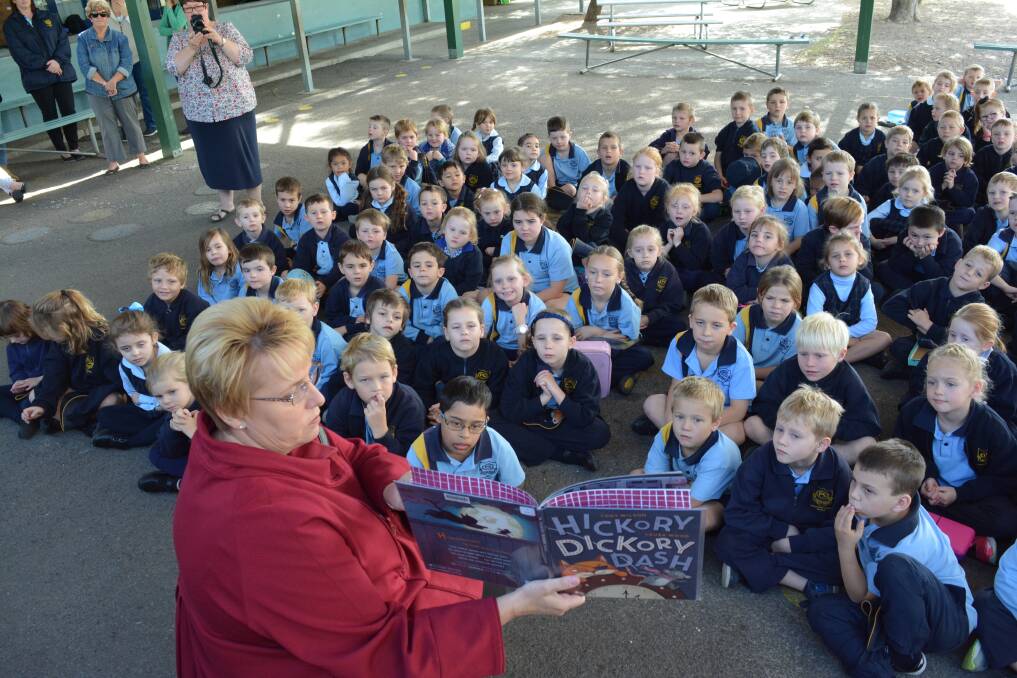 Gloucester Public School principal Leanne Wakefield reads the story to the students from kindergarten to year two. Photo Anne Keen